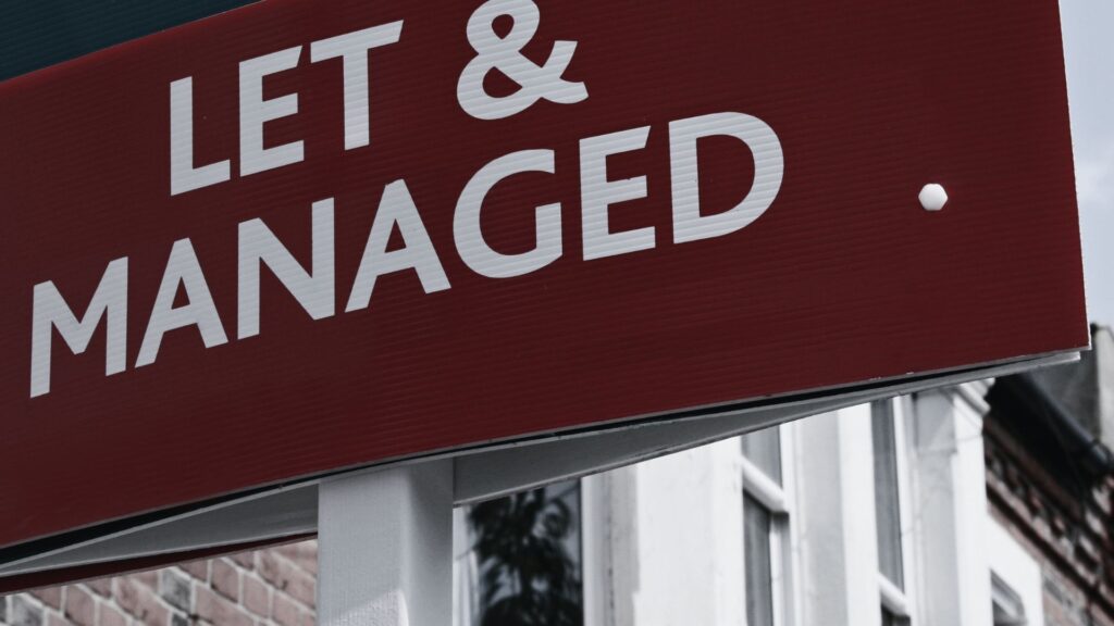 Photo of the sign on the front of property for rent